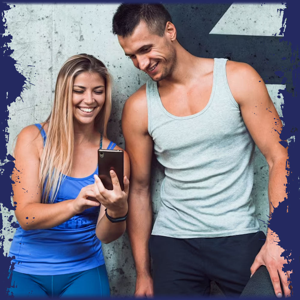 A man and a woman looking happy about something they are looking at on the womans phone